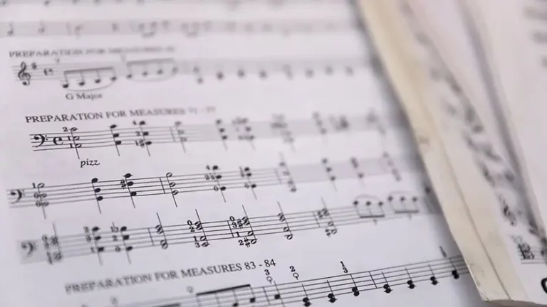 Sheet music pages in soft focus, representing the complexity of music publishing registration and royalty collection
